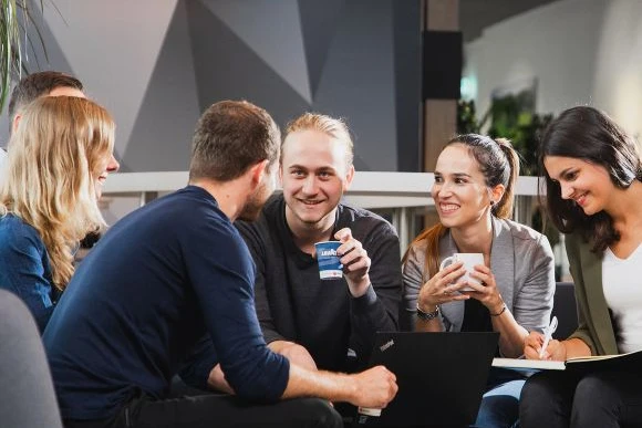 group of people enjoying office coffee